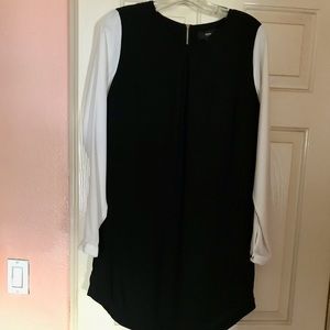 Beautiful black dress with white sleeves definitely pops out size small.